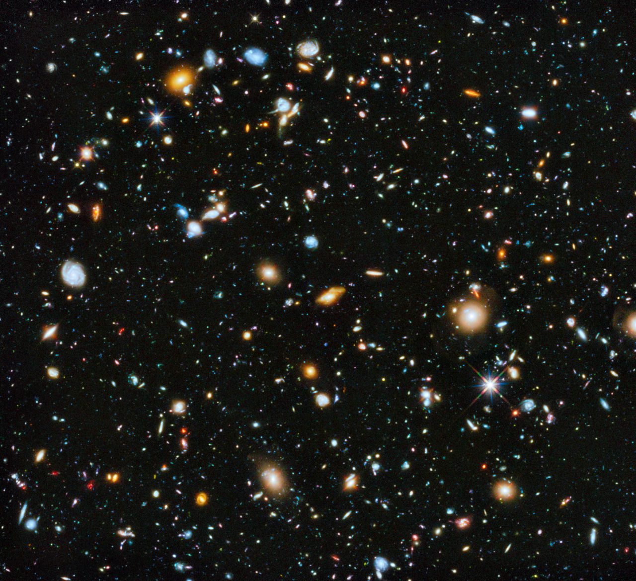 Vibrant cosmic scene showcasing colorful galaxies and stars captured by the Hubble Space Telescope.
