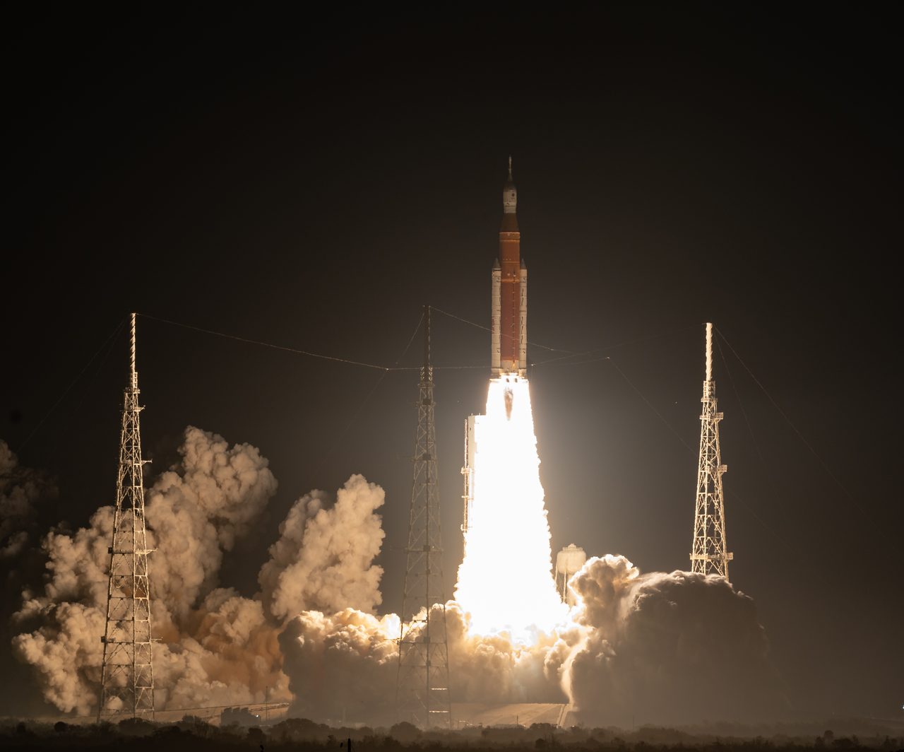 NASA's Space Launch System rocket lifts off with Orion on the Artemis I mission from Kennedy Space Center at night