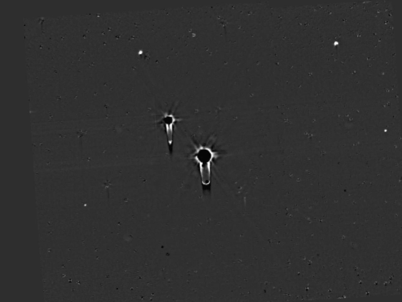 NASA's New Horizons spacecraft conducting a detailed search for hazards near Pluto.