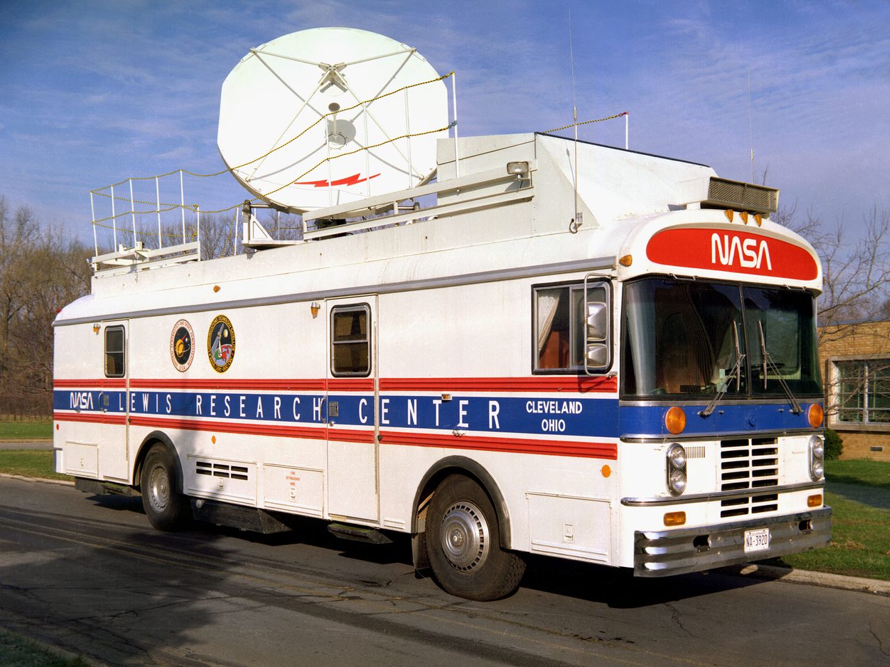 A portable satellite terminal with a dish antenna, used for communication technology in remote locations.