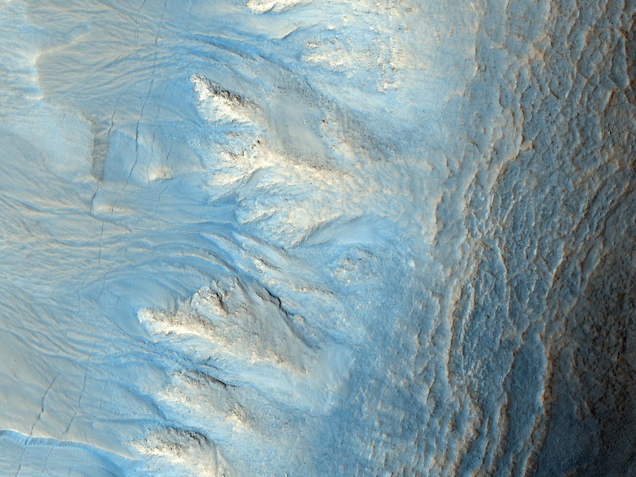 Mars crater with gullies, alcoves, channels, and debris aprons on west-facing slope, captured by NASA Orbiter.