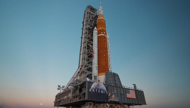 The Space Launch System rocket and Orion spacecraft are rolled out at Kennedy Space Center for an upcoming mission.