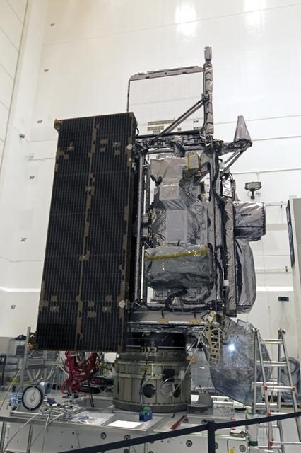 GOES-S satellite being prepared for launch encapsulation in a cleanroom environment.