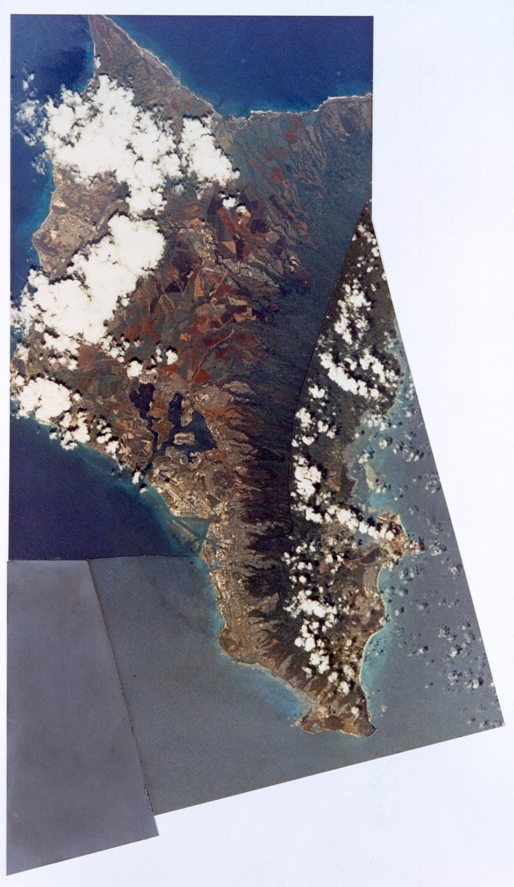 Aerial view of Hawaii from Skylab III, showcasing lush islands surrounded by the Pacific Ocean.