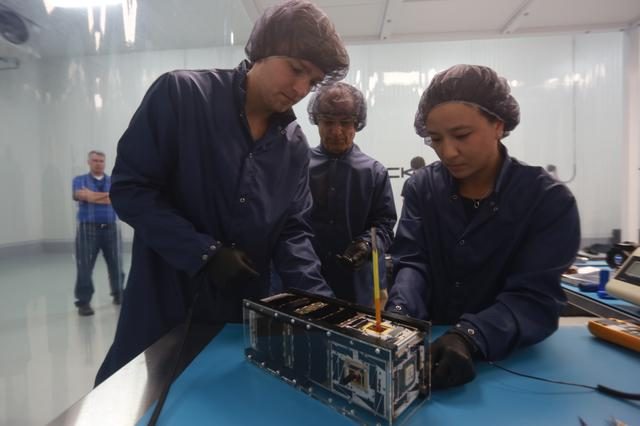 ELaNa 19 mission featuring Venture Class CubeSat CHOMPTT in a laboratory setting.
