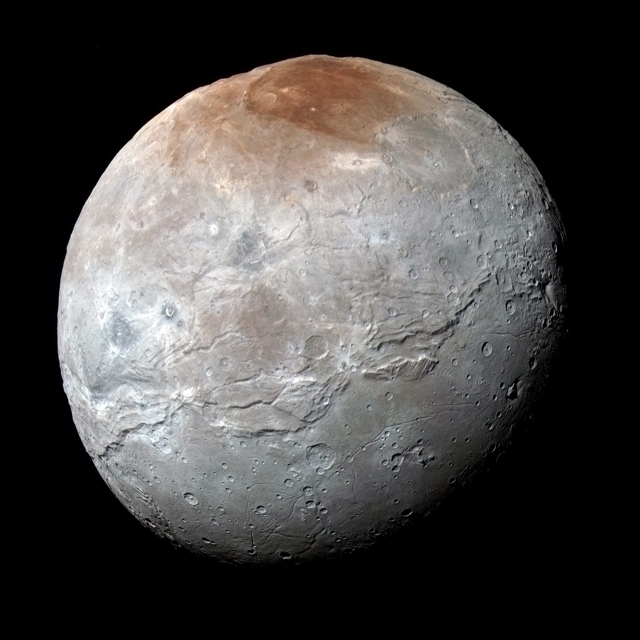 Detailed view of Charon, Pluto's largest moon, showing its rugged surface and prominent geological features.