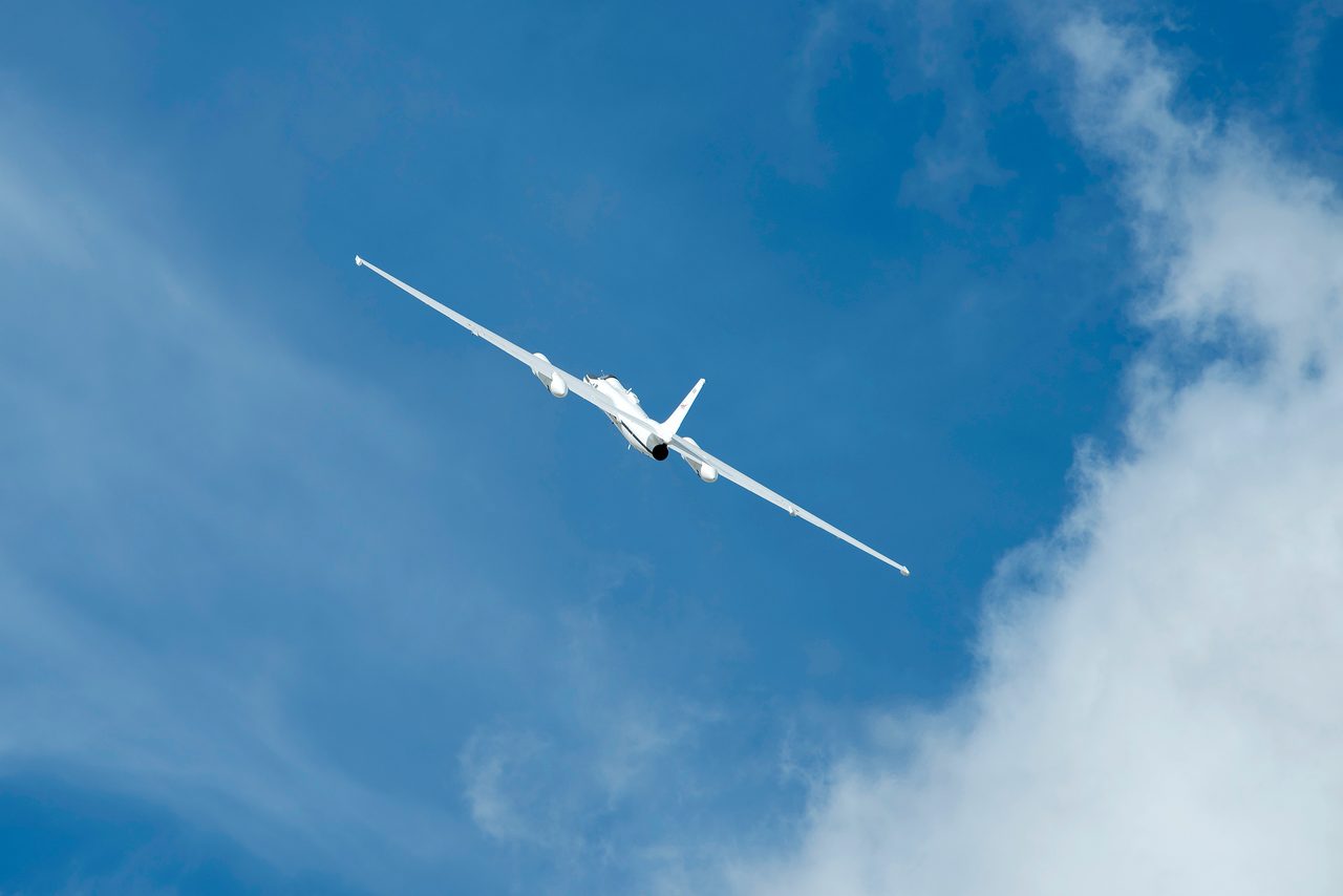 NASA ER-2 aircraft flying over Los Angeles County Airshow with clear blue sky, March 25, 2017.
