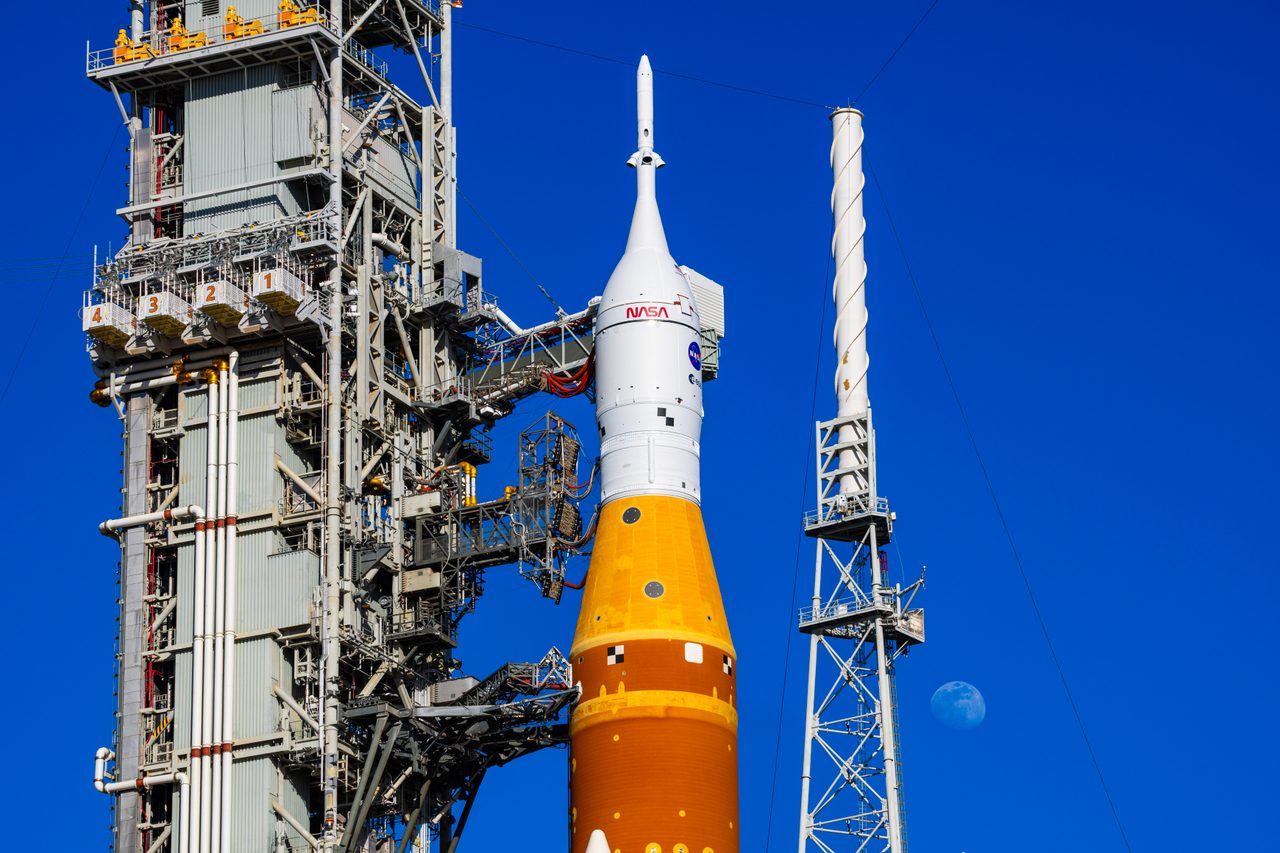 The Moon illuminates the SLS and Orion spacecraft on mobile launcher at Launch Pad 39B, Kennedy Space Center.