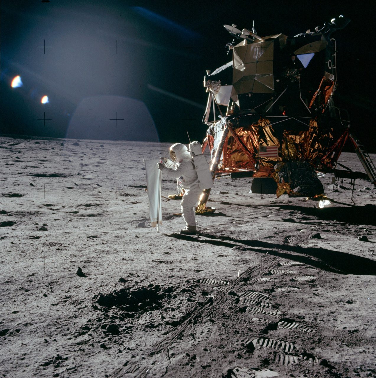 Astronauts from Apollo 11 mission relaxing and enjoying sunlight during a break on the lunar surface.