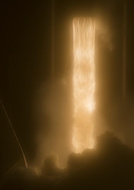 SpaceX Falcon 9 rocket launching Demo-1 mission, marking a milestone in commercial space travel.