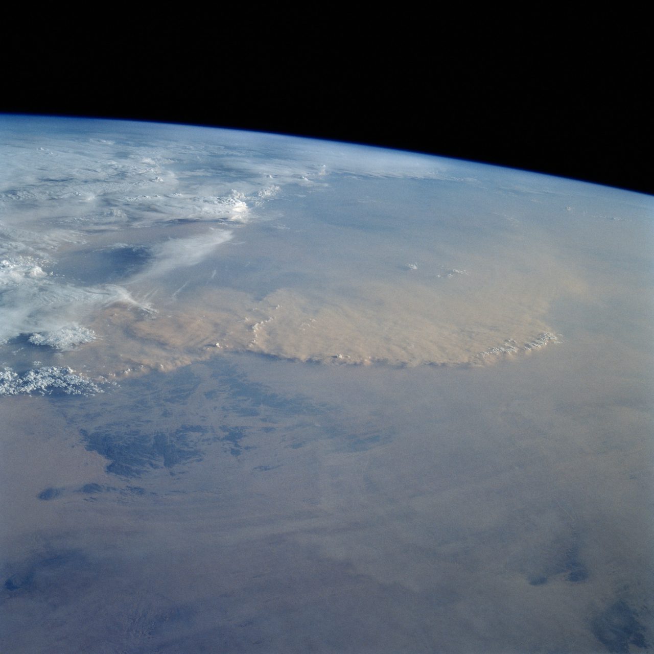 Massive dust storm sweeping across the Sahara Desert near Algeria and Niger border