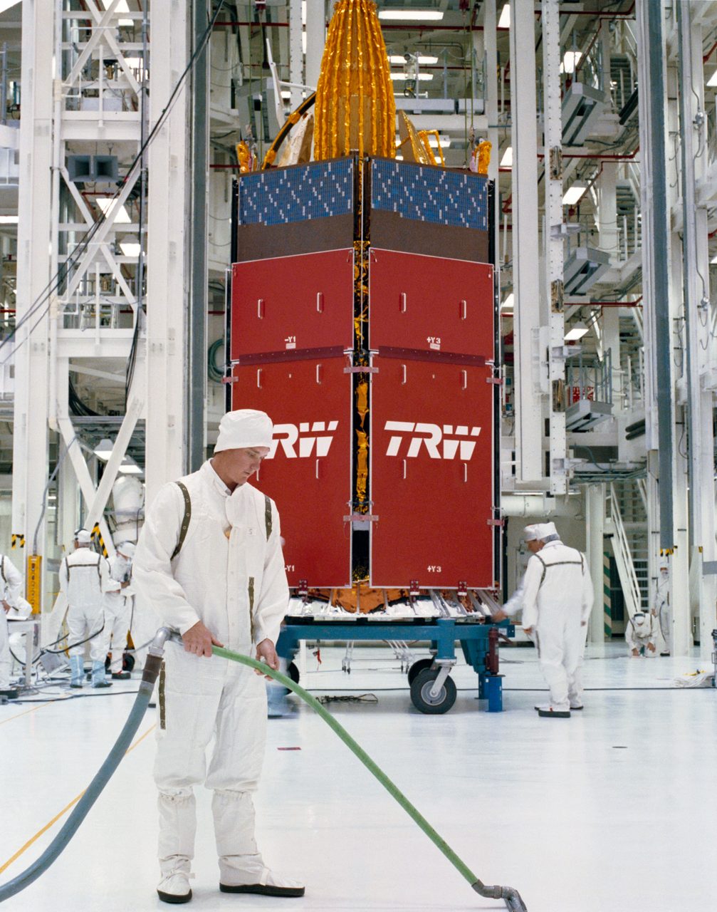 Technicians prepare TDRS-D satellite for launch at Kennedy Space Center's Vertical Processing Facility.