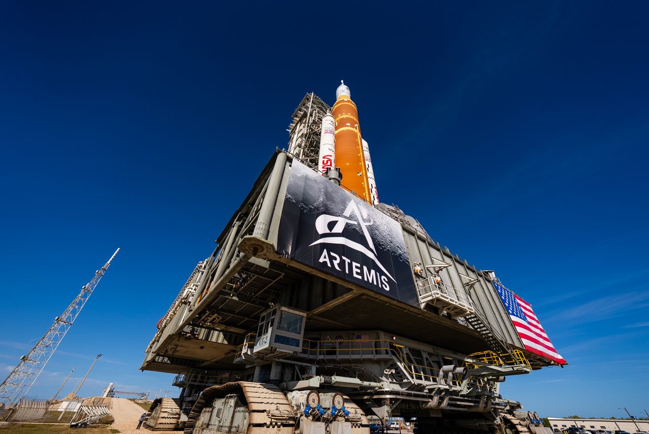 NASA's SLS rocket and Orion spacecraft on massive crawler, moving to Launch Pad 39B for Artemis II mission.