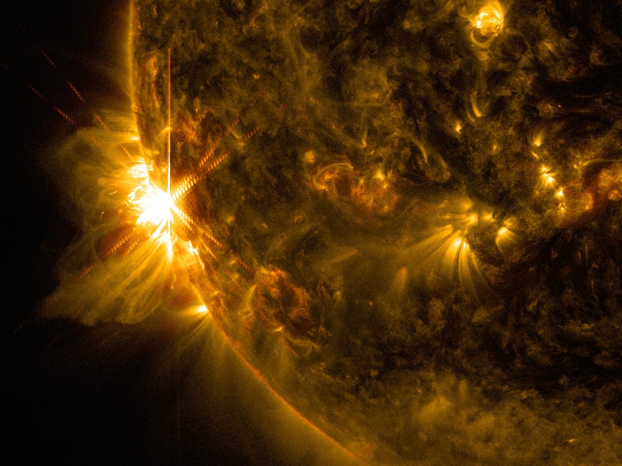 NASA's Solar Dynamics Observatory capturing bright solar flares on the Sun's surface.