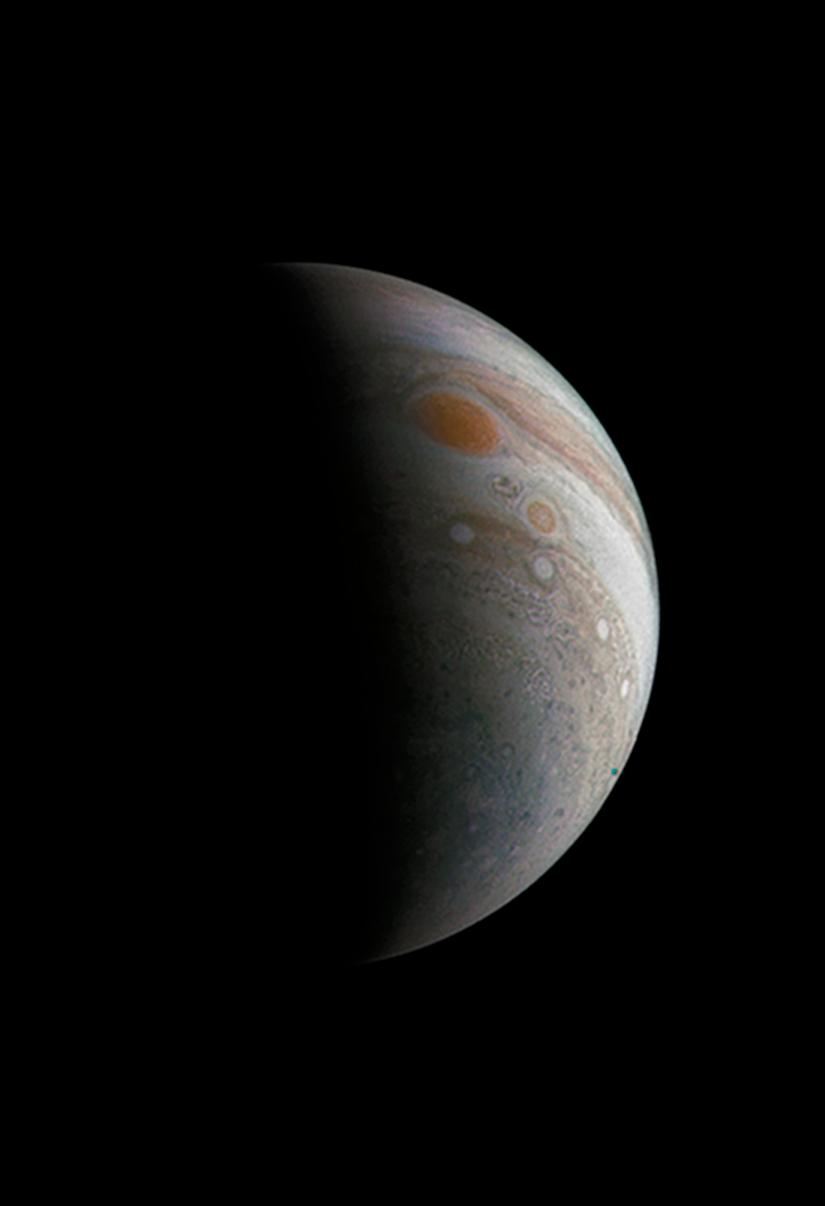 Crescent-shaped Jupiter with its Great Red Spot captured by NASA's Juno spacecraft, processed by citizen scientist.
