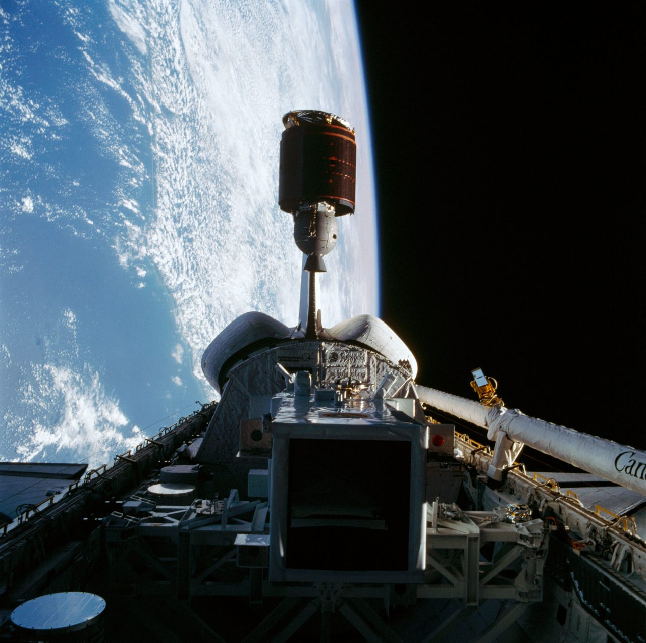 Telstar 3-D satellite deploying from Space Shuttle Discovery's open payload bay.