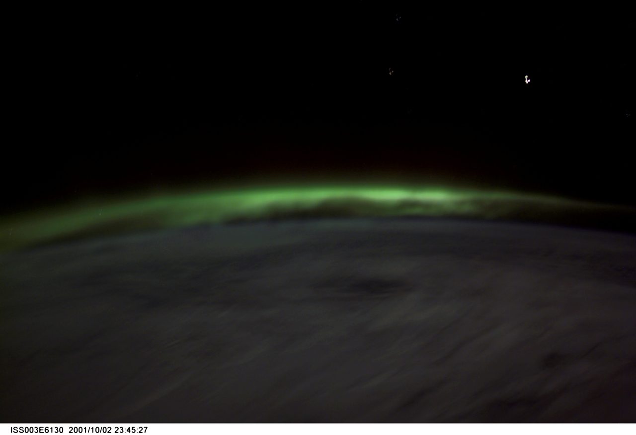 Vibrant aurora lights observed from space during the Expedition Three mission.