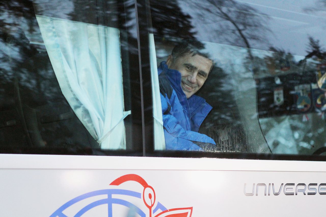 Yuri Malenchenko smiles while leaving Gagarin Cosmonaut Training Center for Baikonur Cosmodrome launch site in Kazakhstan.
