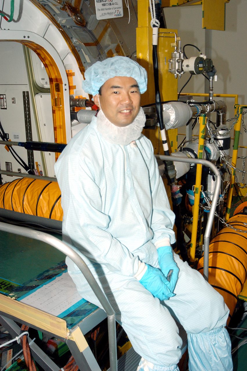Astronaut Soichi Noguchi inside the Japanese Experiment Module during testing at Kennedy Space Center.